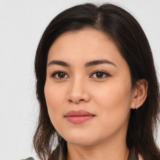 Joyful asian young-adult female with long  brown hair and brown eyes