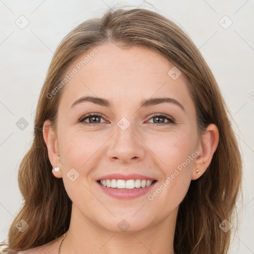 Joyful white young-adult female with long  brown hair and grey eyes