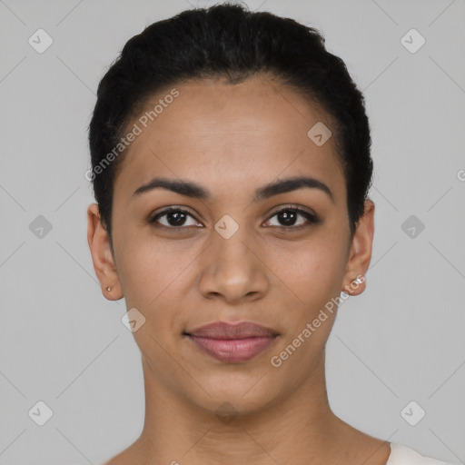 Joyful latino young-adult female with short  black hair and brown eyes