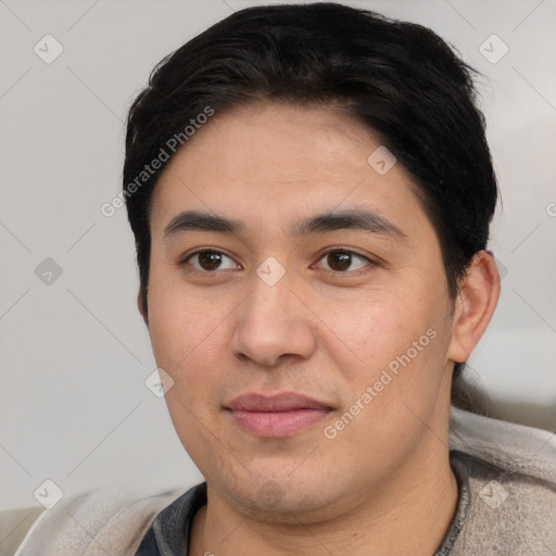 Joyful white young-adult male with short  black hair and brown eyes