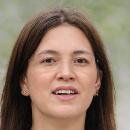 Joyful white adult female with long  brown hair and brown eyes