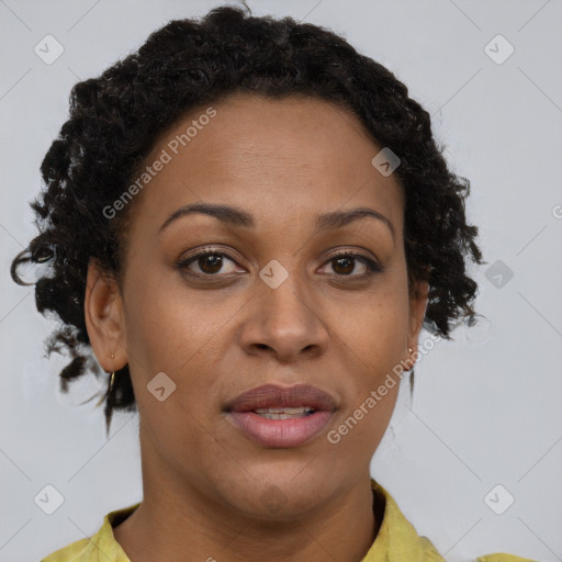 Joyful black adult female with short  brown hair and brown eyes