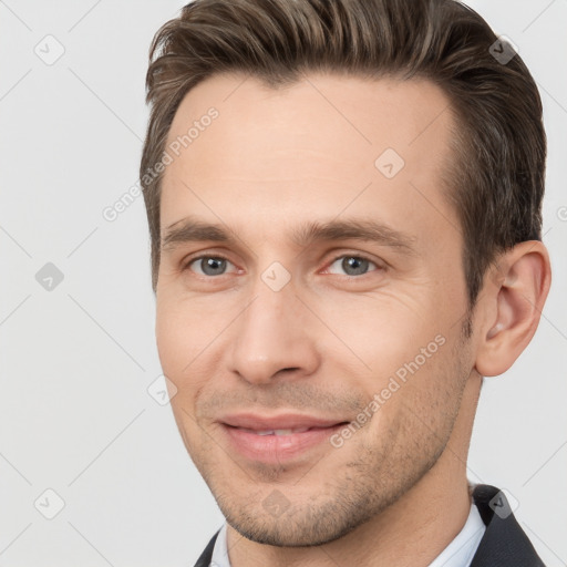 Joyful white young-adult male with short  brown hair and brown eyes