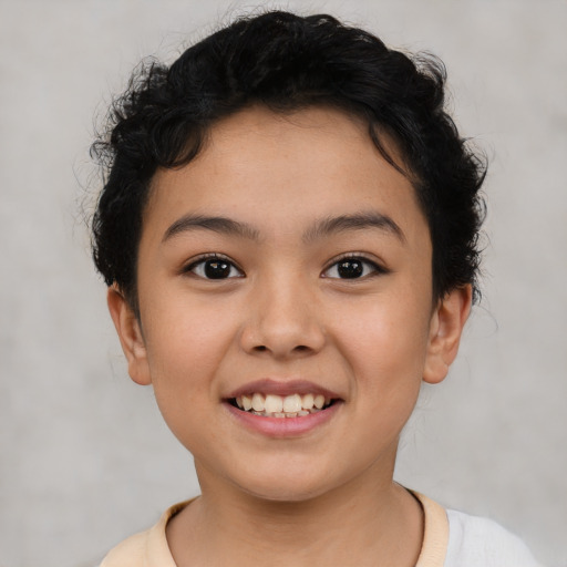 Joyful latino child female with short  brown hair and brown eyes