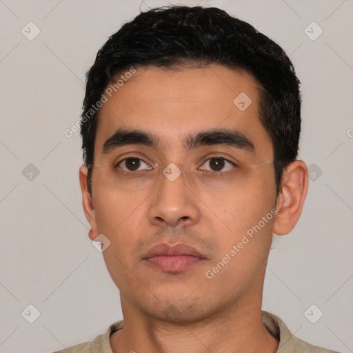 Neutral latino young-adult male with short  black hair and brown eyes