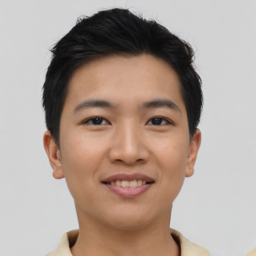 Joyful asian young-adult male with short  brown hair and brown eyes
