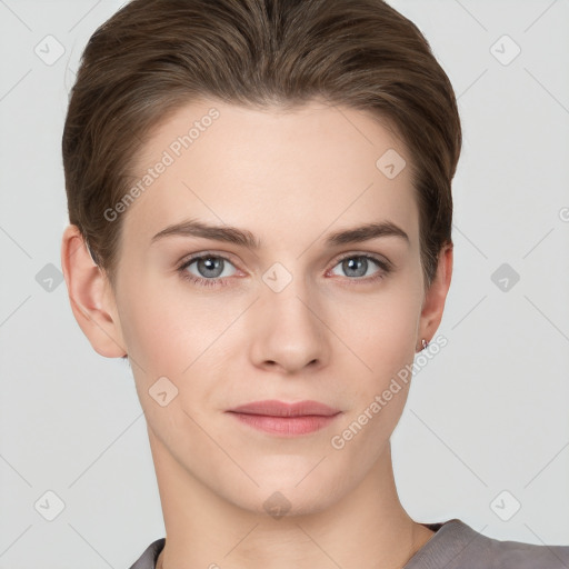 Joyful white young-adult female with short  brown hair and grey eyes