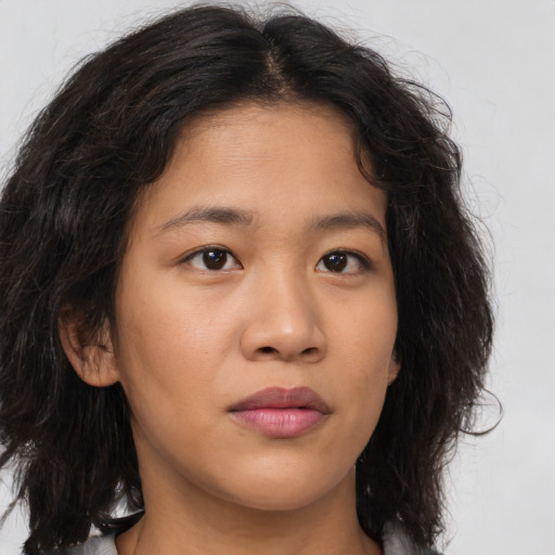 Neutral latino young-adult female with long  brown hair and brown eyes