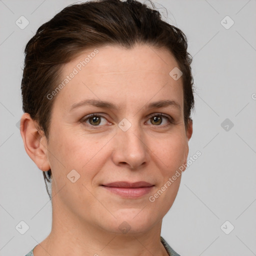 Joyful white adult female with short  brown hair and grey eyes