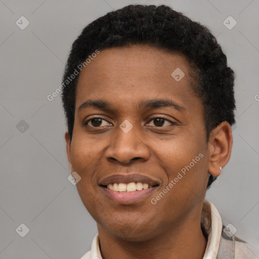 Joyful black young-adult male with short  brown hair and brown eyes