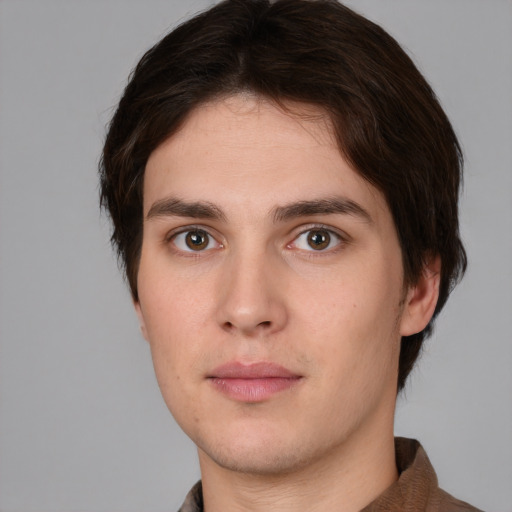 Neutral white young-adult male with short  brown hair and brown eyes