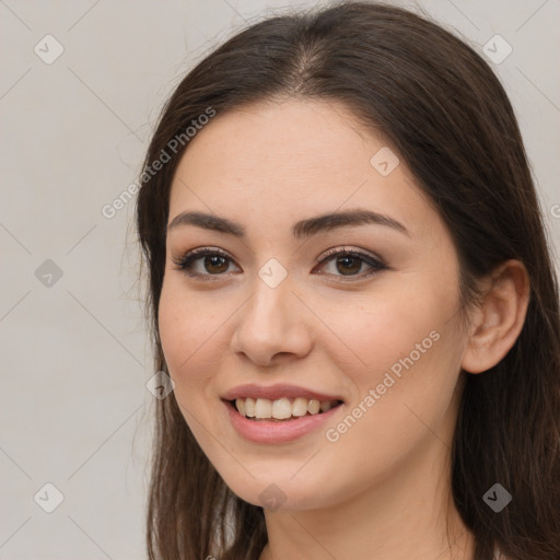 Joyful white young-adult female with long  brown hair and brown eyes