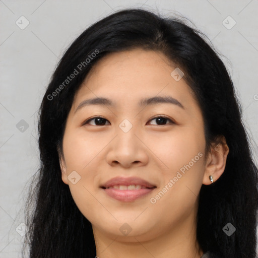 Joyful asian young-adult female with long  black hair and brown eyes