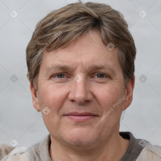 Joyful white adult male with short  brown hair and grey eyes