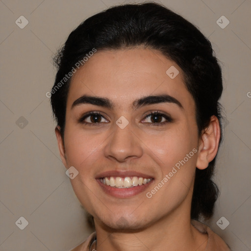 Joyful latino young-adult female with medium  brown hair and brown eyes