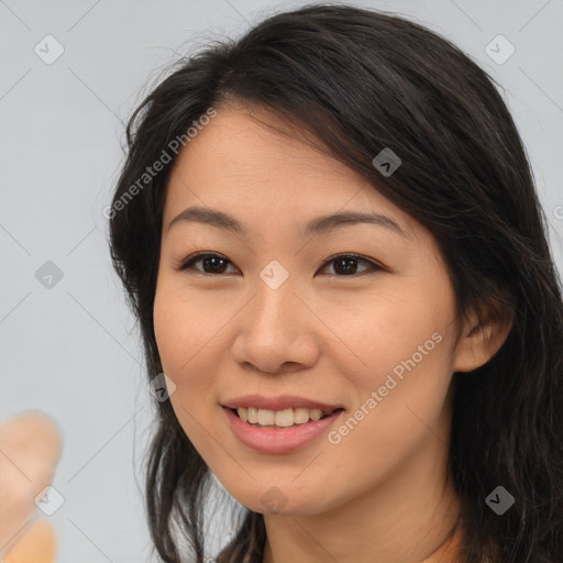 Joyful latino young-adult female with long  brown hair and brown eyes