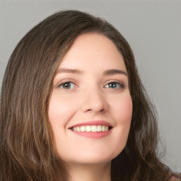 Joyful white young-adult female with long  brown hair and green eyes