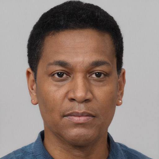 Neutral black adult male with short  black hair and brown eyes