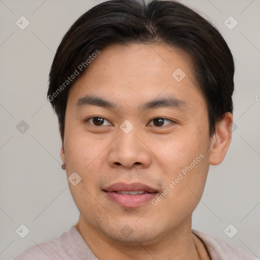 Joyful asian young-adult male with short  brown hair and brown eyes