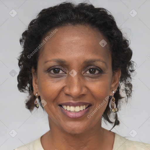 Joyful black adult female with medium  brown hair and brown eyes