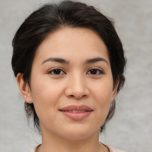 Joyful asian young-adult female with medium  brown hair and brown eyes
