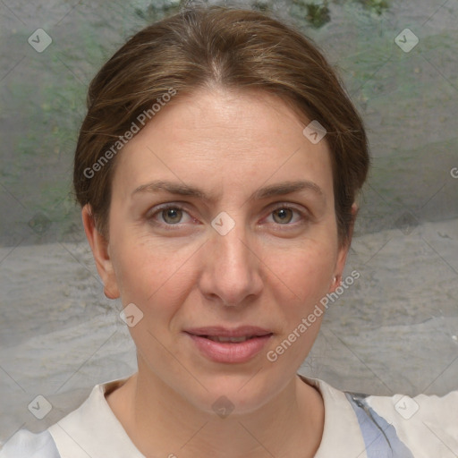 Joyful white adult female with short  brown hair and grey eyes