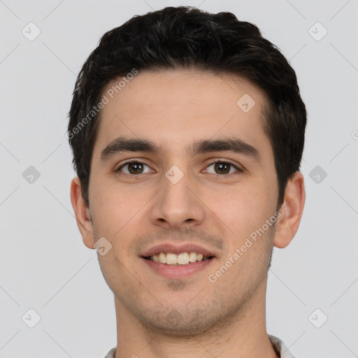 Joyful white young-adult male with short  black hair and brown eyes