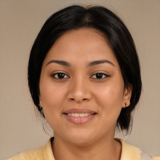 Joyful latino young-adult female with medium  black hair and brown eyes