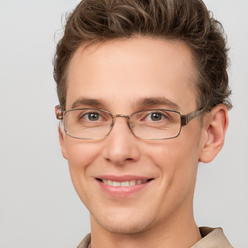 Joyful white adult male with short  brown hair and grey eyes