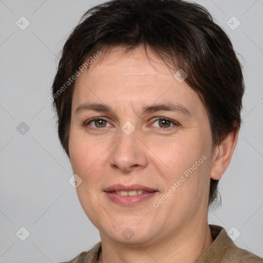 Joyful white adult female with short  brown hair and brown eyes