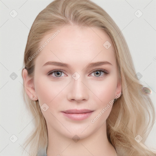 Joyful white young-adult female with long  brown hair and blue eyes