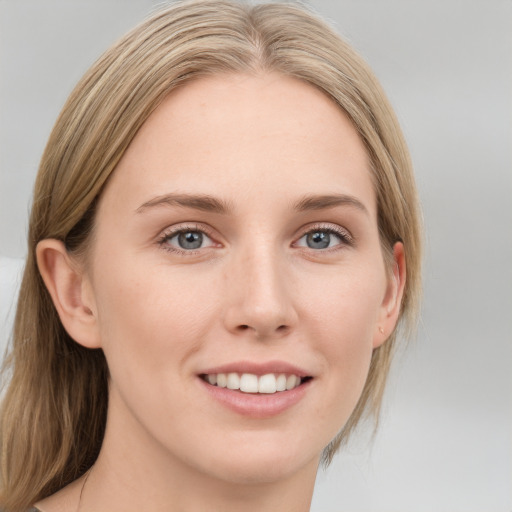 Joyful white young-adult female with medium  brown hair and blue eyes