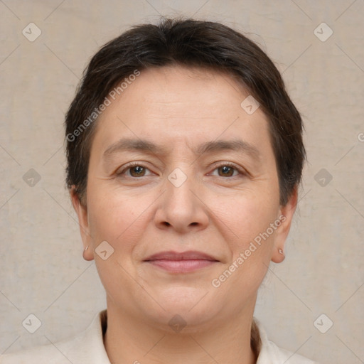 Joyful white adult female with short  brown hair and brown eyes