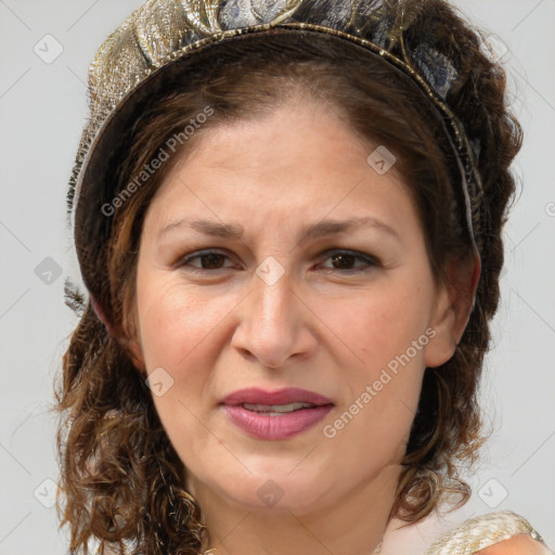 Joyful white adult female with medium  brown hair and blue eyes