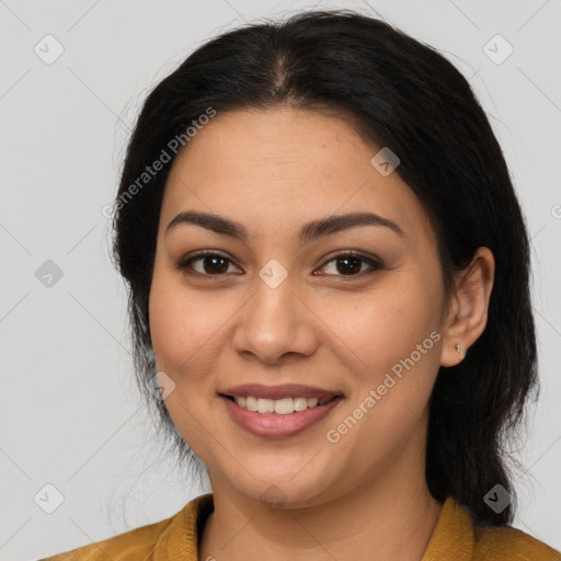 Joyful latino young-adult female with medium  brown hair and brown eyes