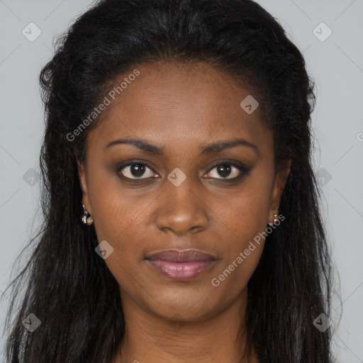 Joyful black young-adult female with long  brown hair and brown eyes