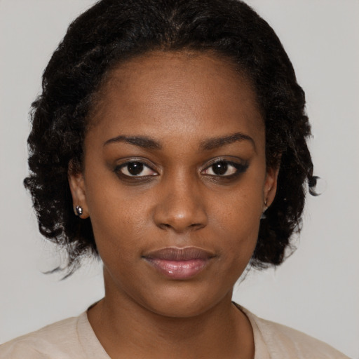 Neutral black young-adult female with medium  brown hair and brown eyes