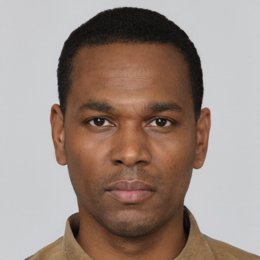 Neutral black young-adult male with short  black hair and brown eyes