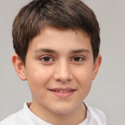 Joyful white child male with short  brown hair and brown eyes