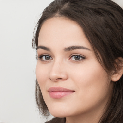 Neutral white young-adult female with long  brown hair and brown eyes