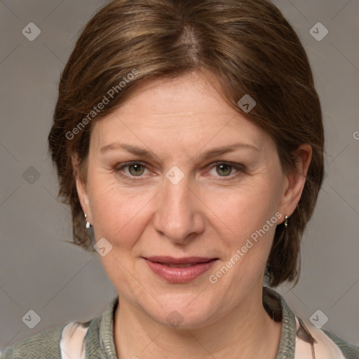 Joyful white adult female with medium  brown hair and grey eyes