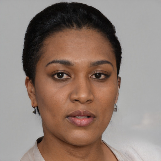 Neutral black young-adult female with short  black hair and brown eyes