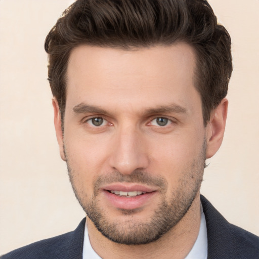 Joyful white young-adult male with short  brown hair and brown eyes