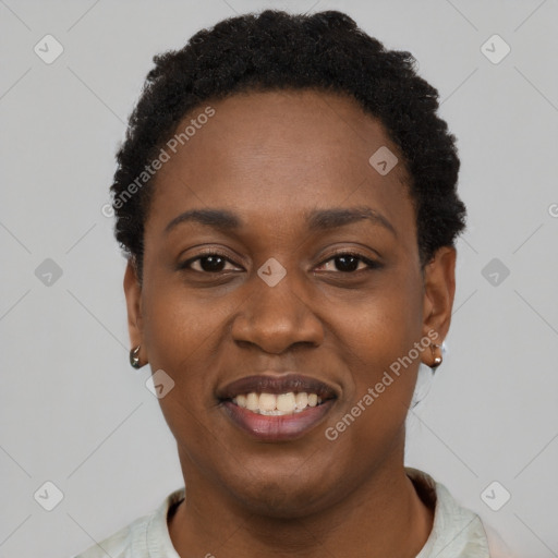 Joyful black young-adult female with short  black hair and brown eyes