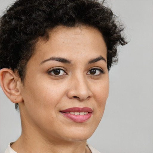 Joyful latino young-adult female with short  brown hair and brown eyes