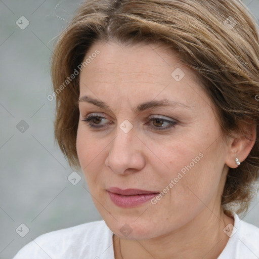 Joyful white adult female with medium  brown hair and brown eyes