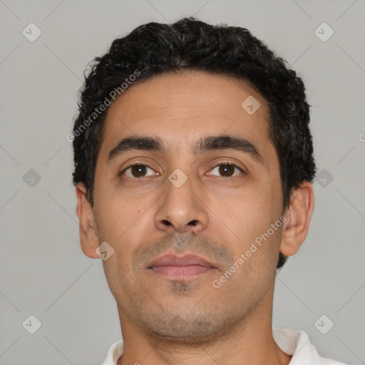 Neutral latino young-adult male with short  black hair and brown eyes