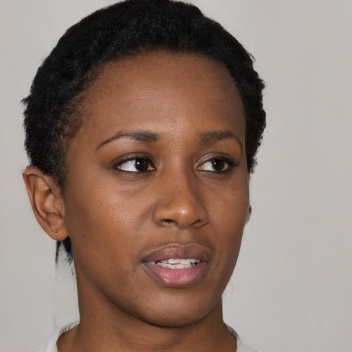 Neutral black young-adult female with short  brown hair and brown eyes