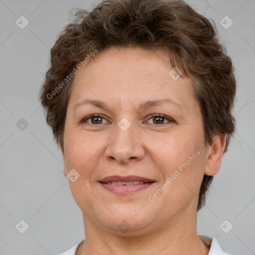 Joyful white adult female with short  brown hair and brown eyes