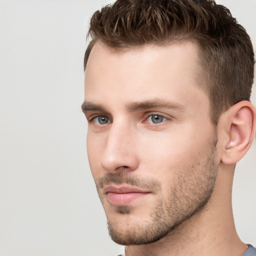 Neutral white young-adult male with short  brown hair and grey eyes